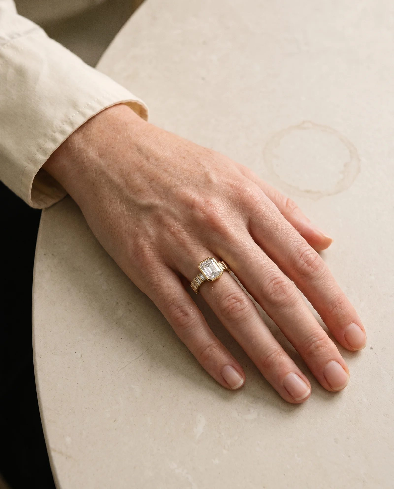 Stanza, East-West Emerald Cut with Baguette Band in Yellow Gold, emerald, worn