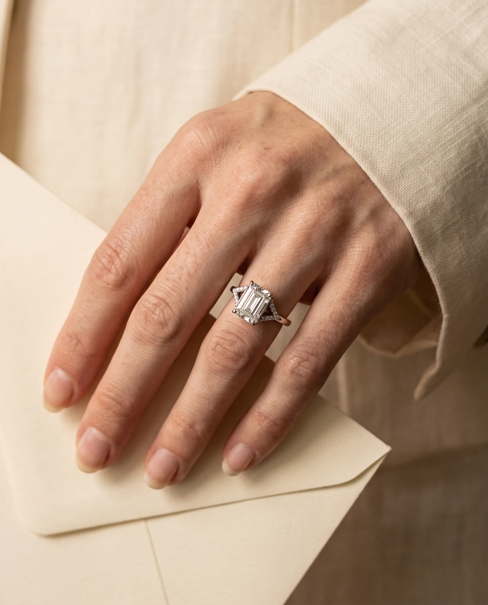 Wren, Four Prong Emerald Solitaire, Pavé Band, Split Shank in White Gold, emerald, worn