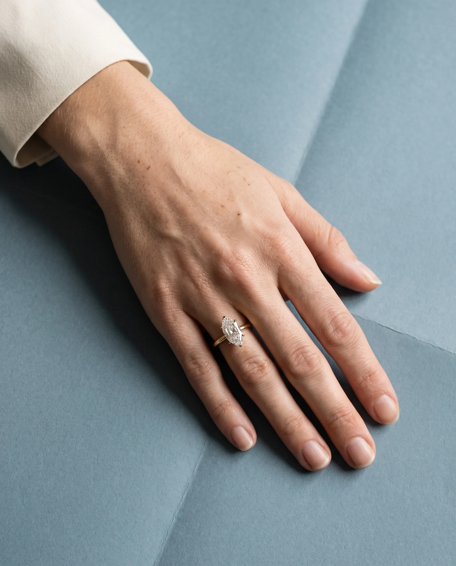 Juniper, Four Prong Step-cut oval Solitaire in Yellow Gold, oval, worn