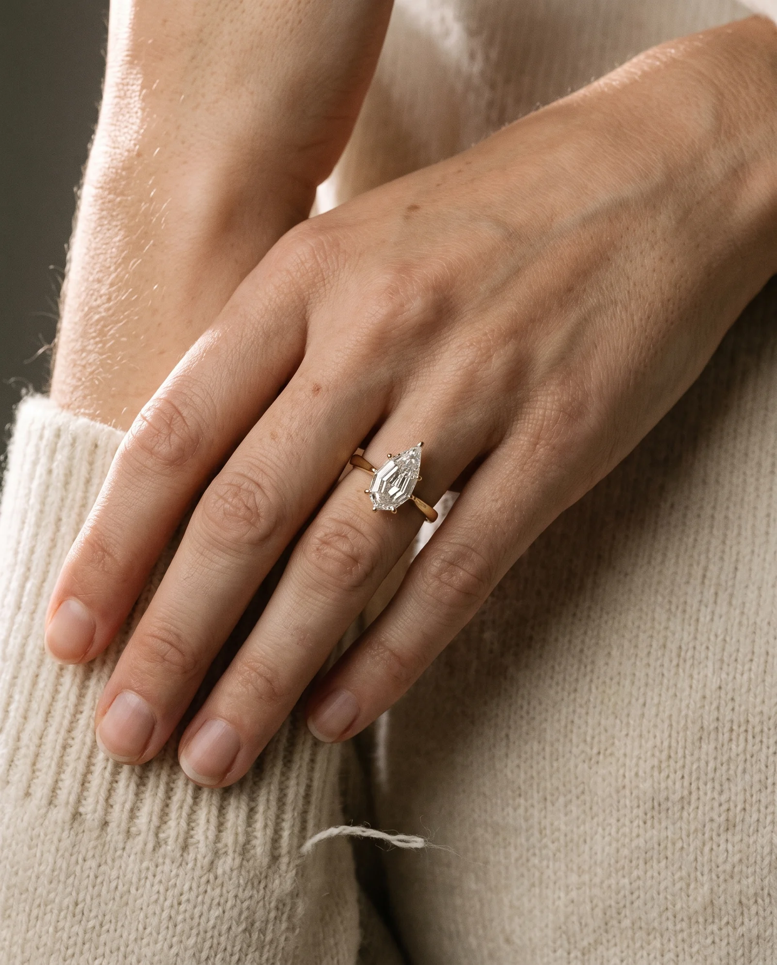 Nook, Three Prong Step-cut Pear Solitaire in Yellow Gold, pear, worn