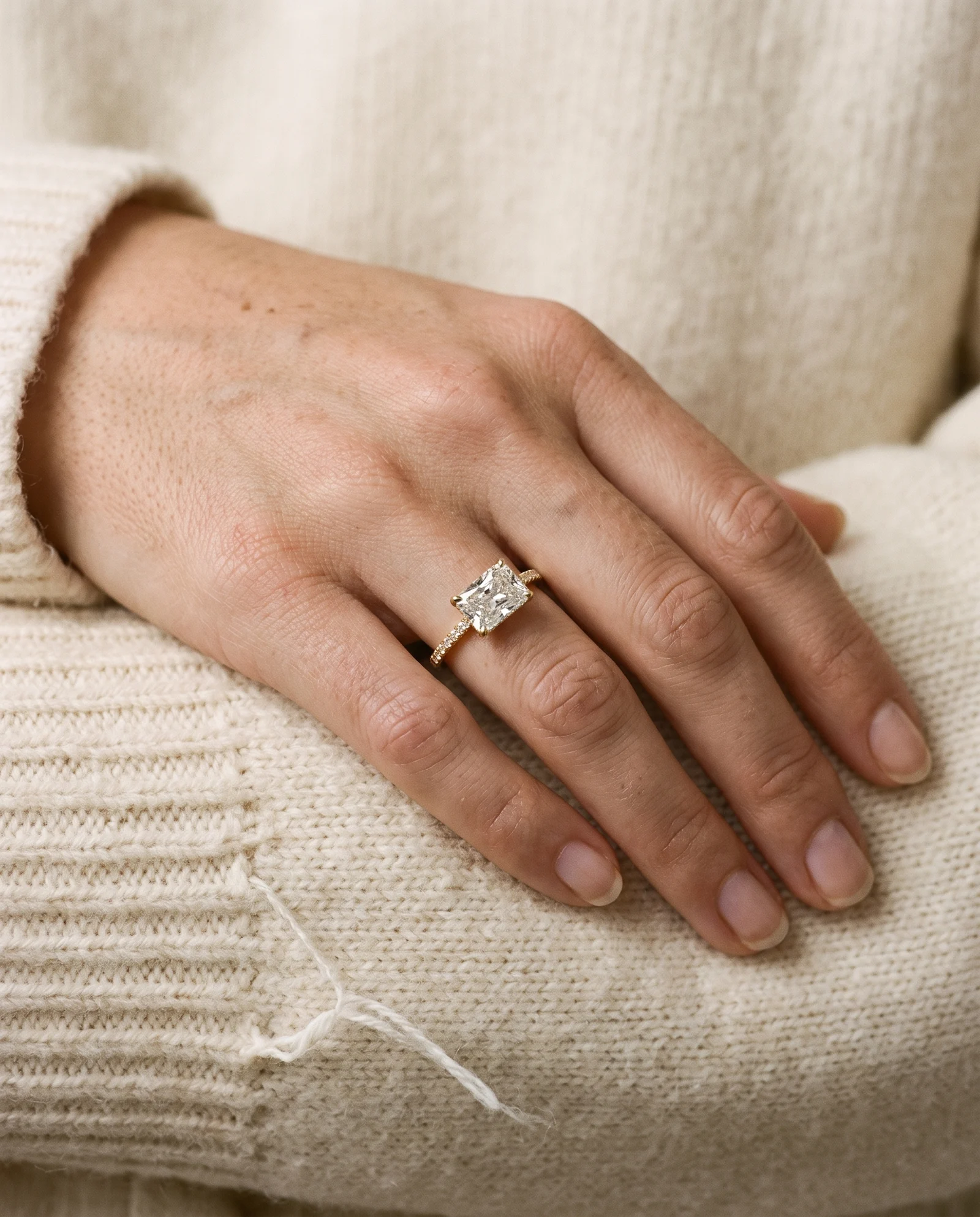 Moss, Four Prong Radiant East-West Solitaire, Pavé Band in Yellow Gold, radiant, worn