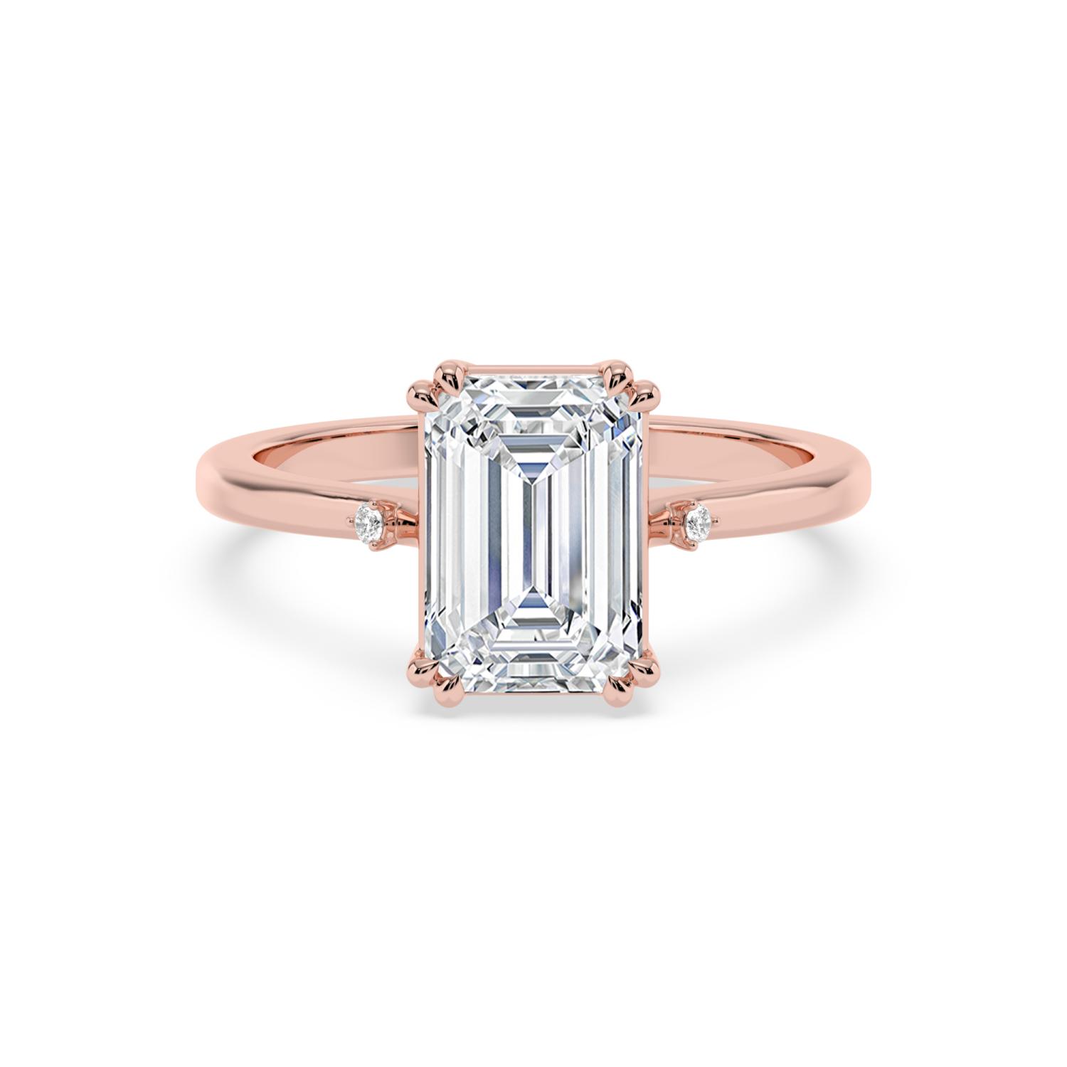 Haven, Double Claw Emerald Solitaire, One Small Stone Each Side in Rose Gold, emerald, plain background