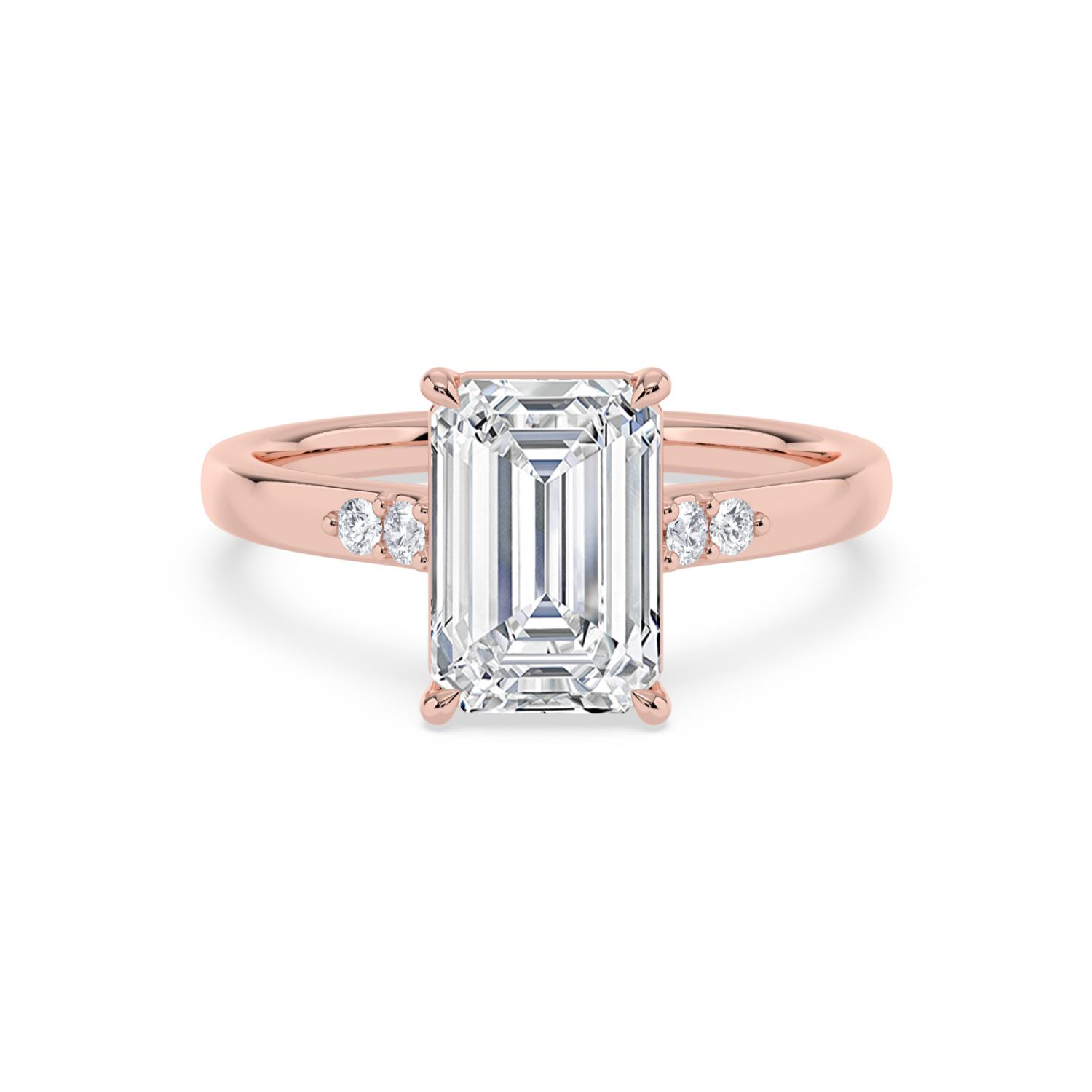 Marsh, Four Prong Emerald Solitaire, Two Small Stones Each Side in Rose Gold, emerald, plain background