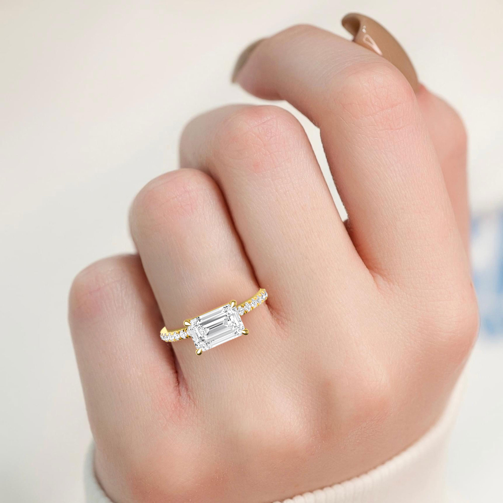 Clove, Four Prong Emerald East-West Solitaire, Pavé Band in Yellow Gold, emerald, plain background, alternate view